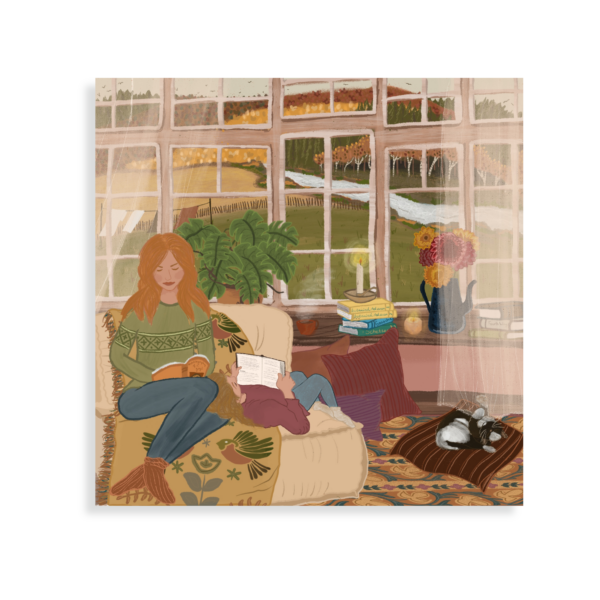 A mother and daughter sitting inside a cosy room with the leaves turning brown in the autumn outside