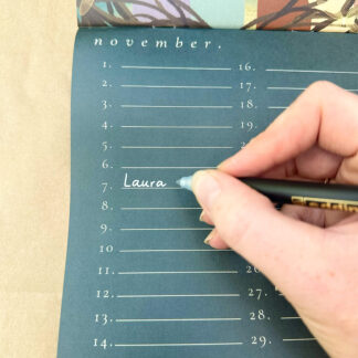 Write with a silver metallic pen on the darker pages of the calendars